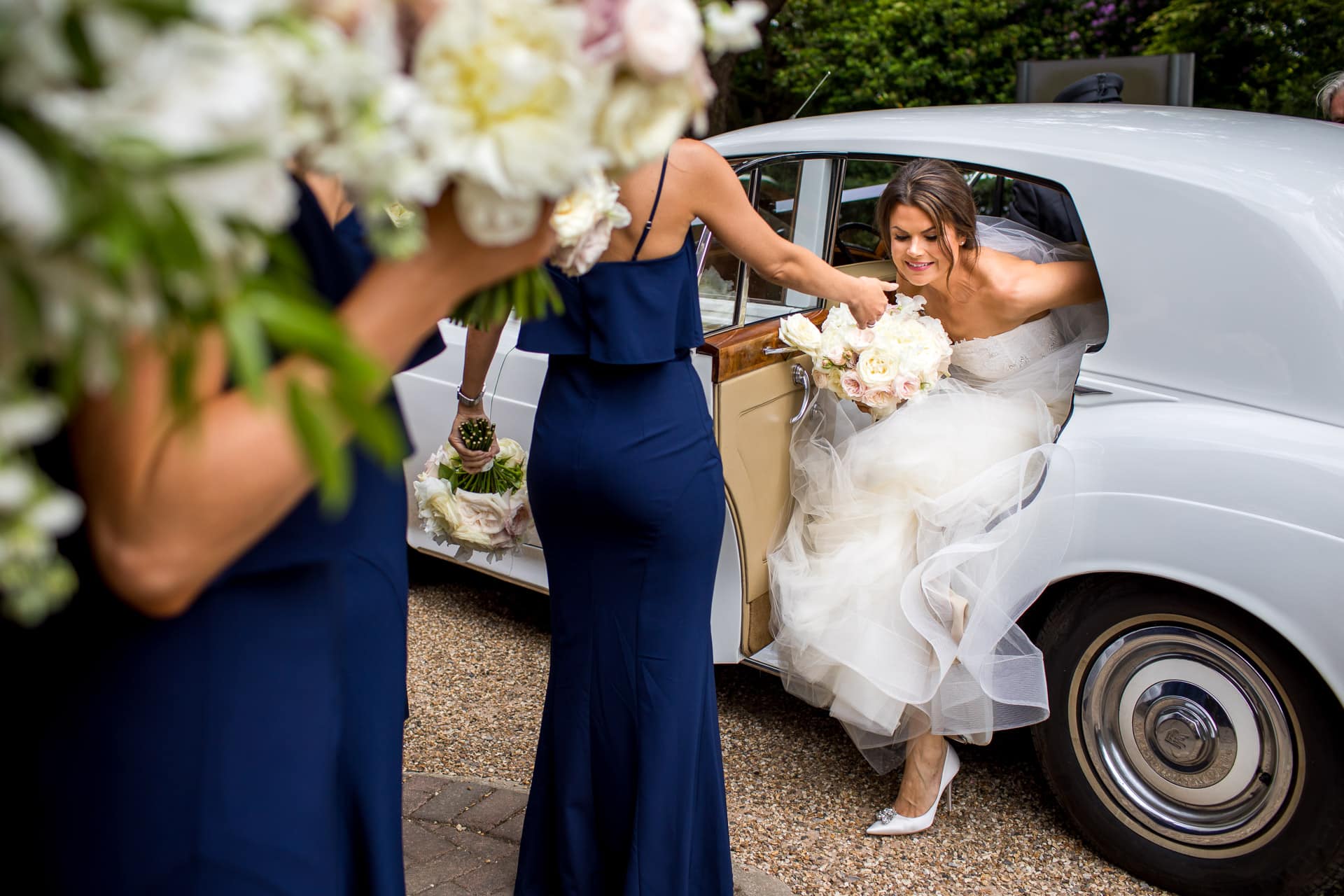 bride getting out of a rolls royce