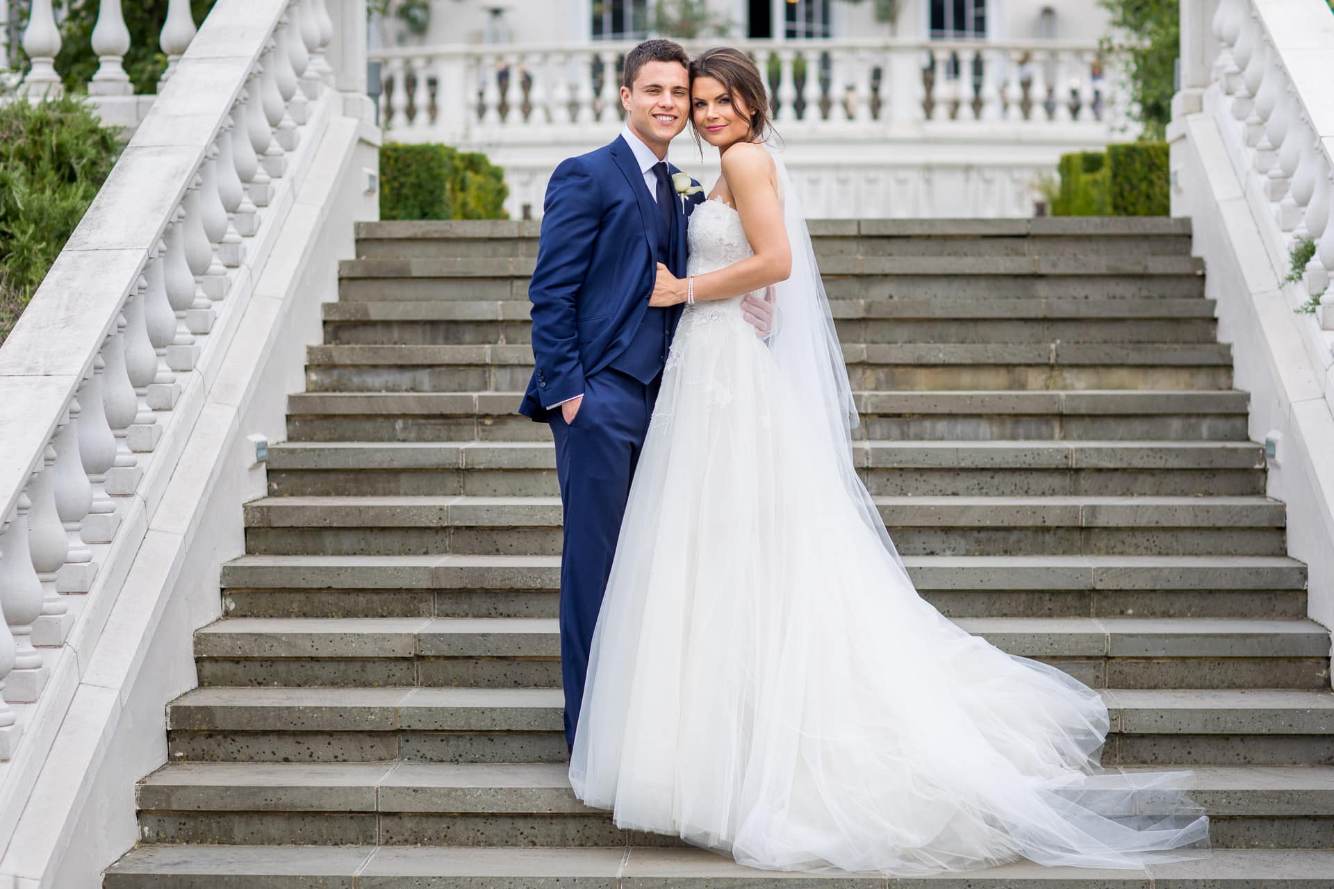 wedding couple on the steps of Coworth Park