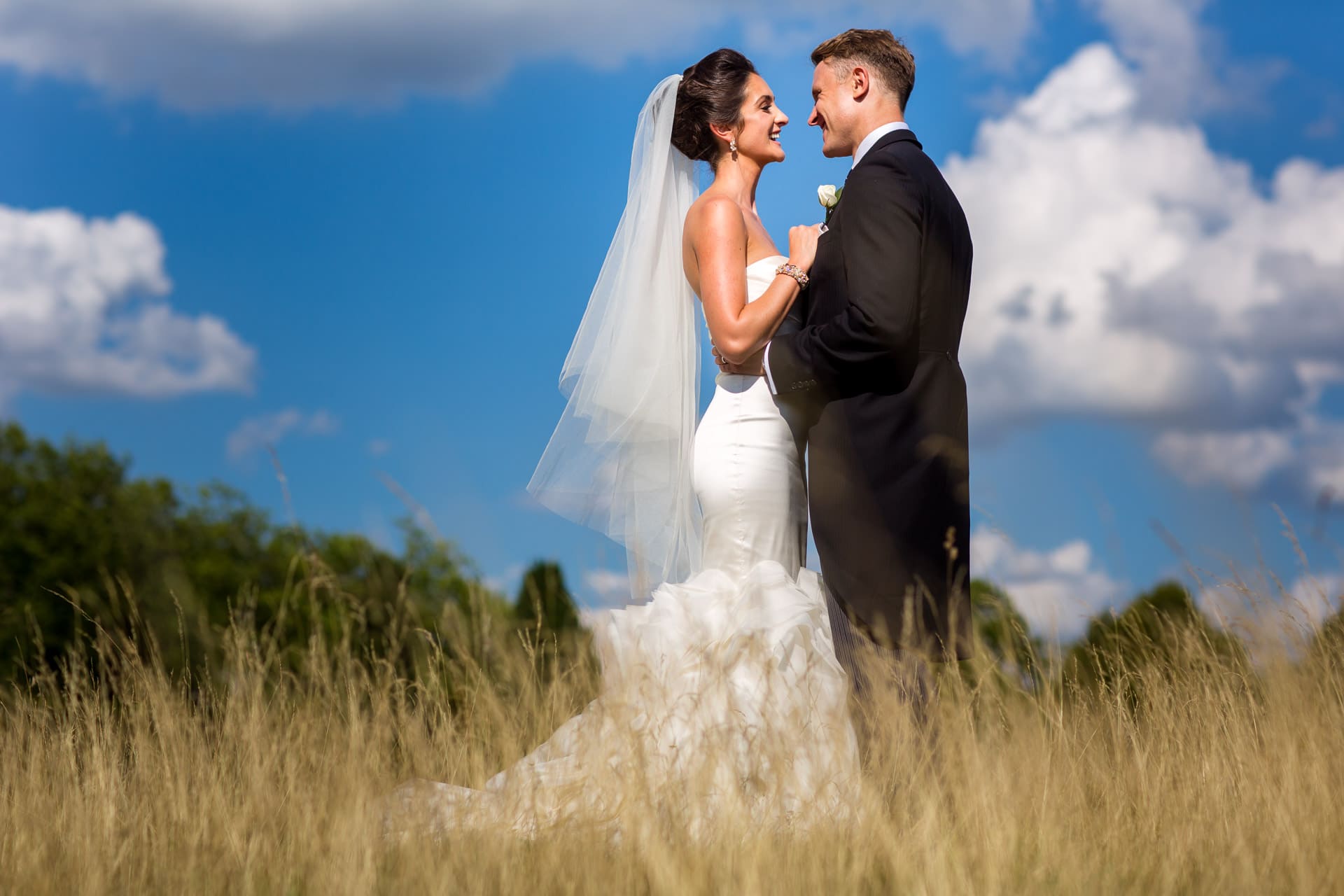 bride and groom with blue sky