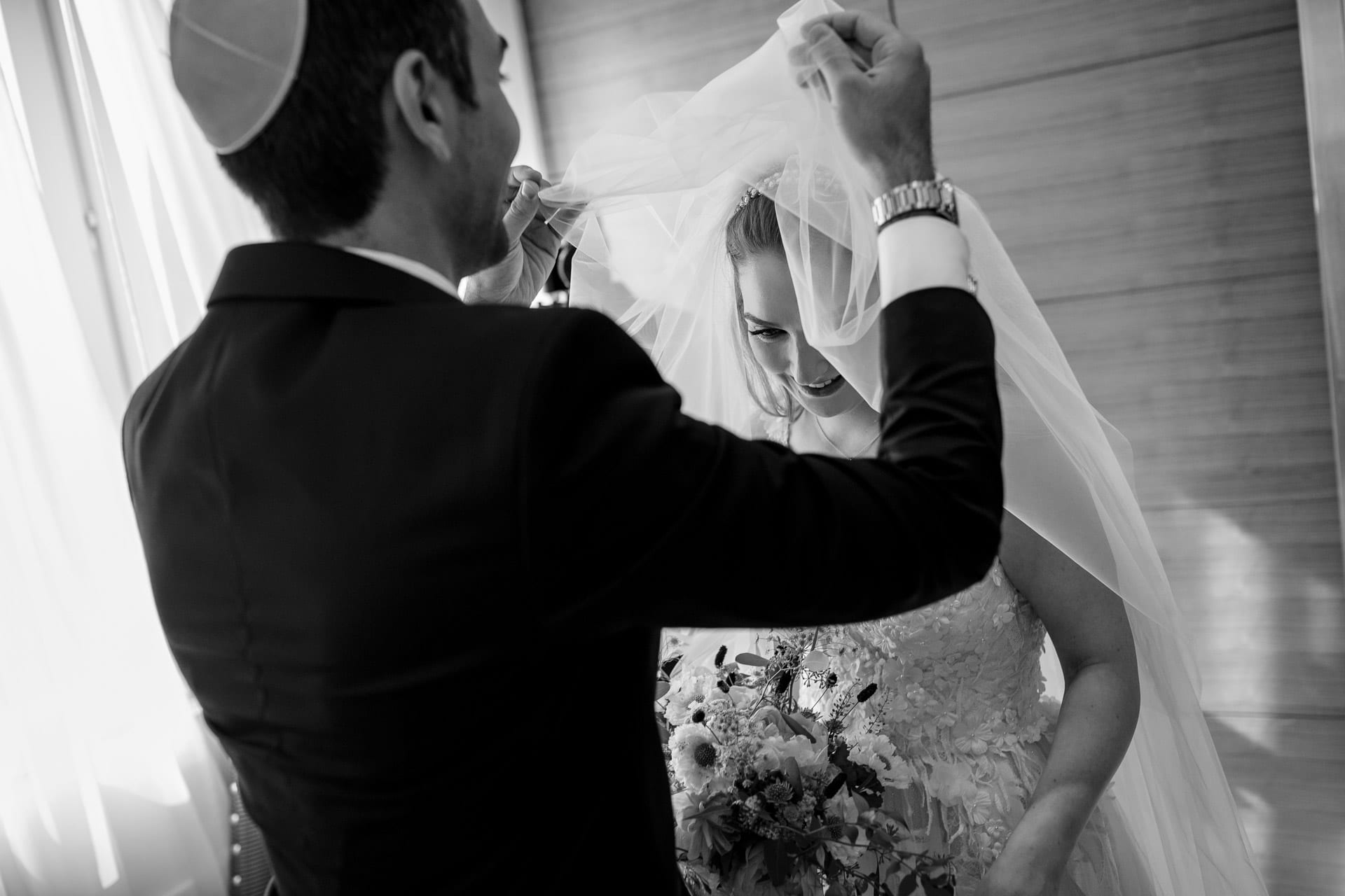 lifting the veil at a bedeken ceremony