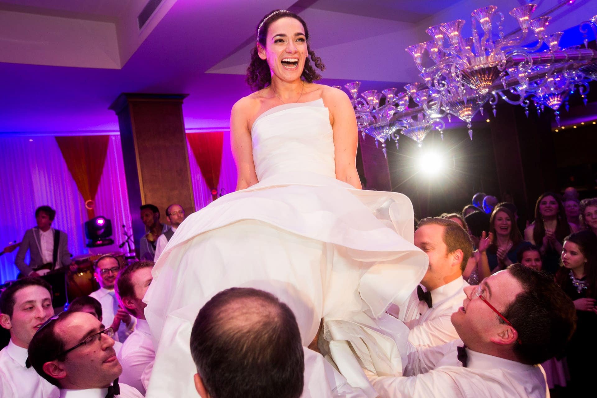 Jewish bride up on a chair