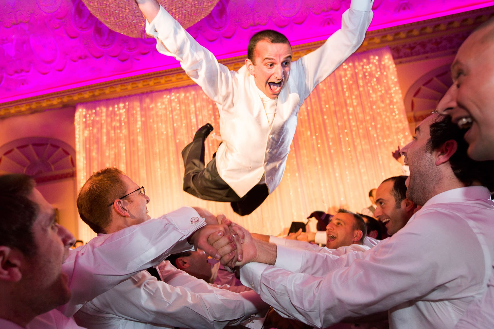 jewish groom jumping during Israeli dancing