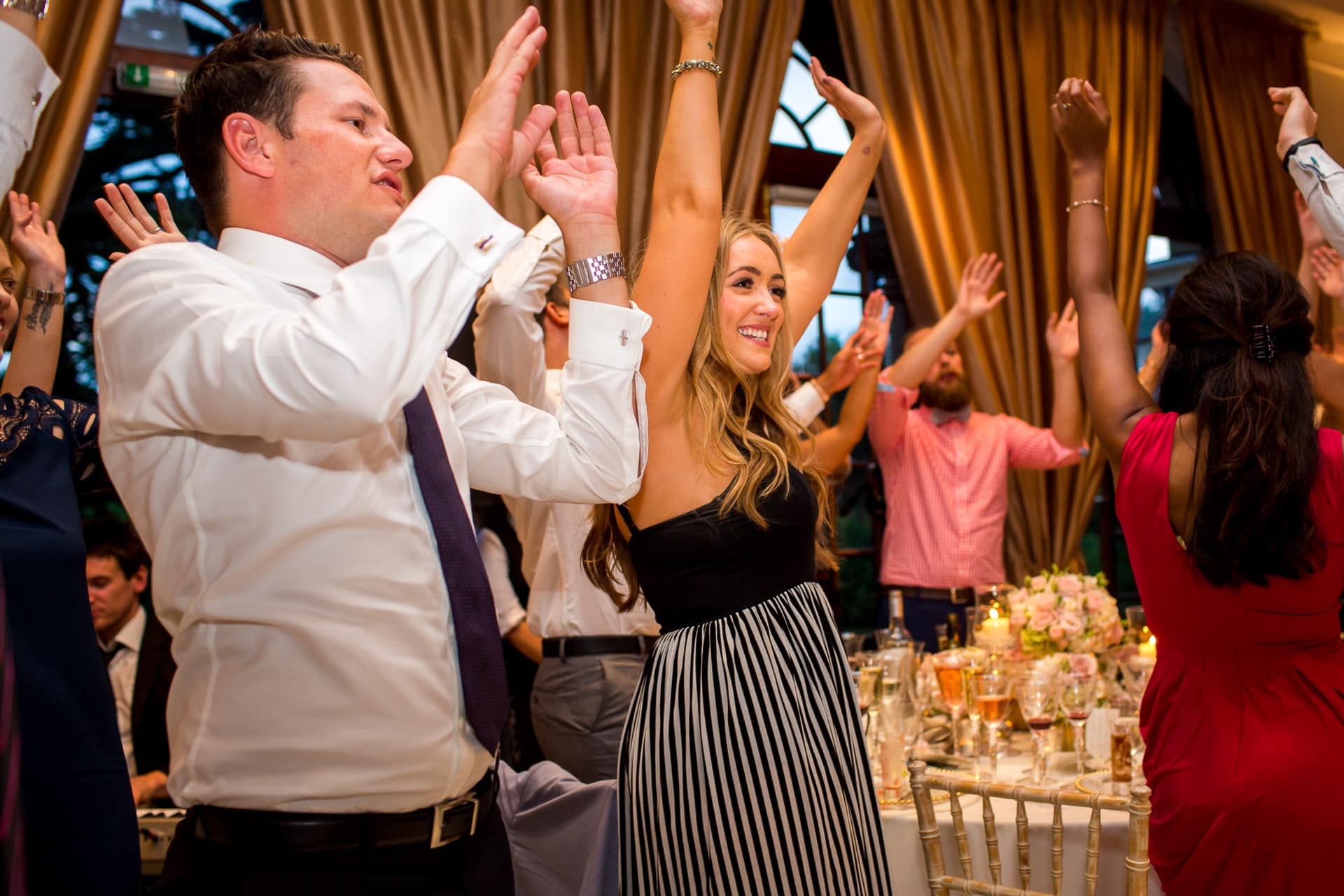 wedding guests dancing during dinner