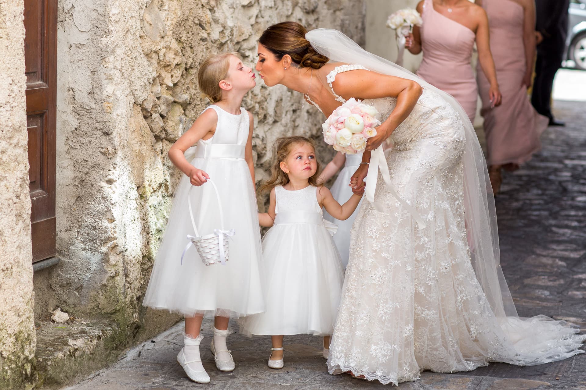 bride kissing her daughter