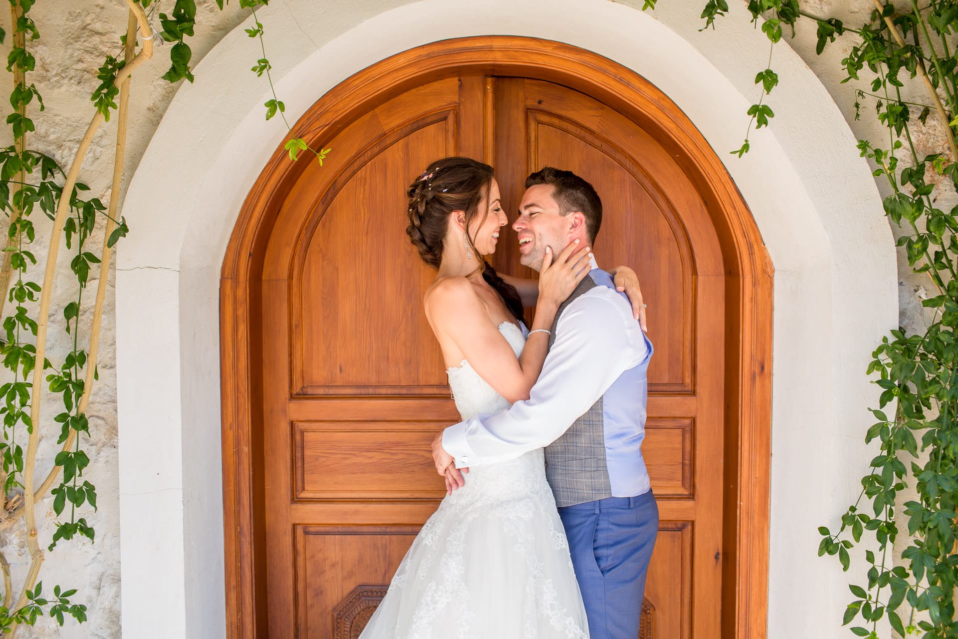 cute wedding couple in a doorway