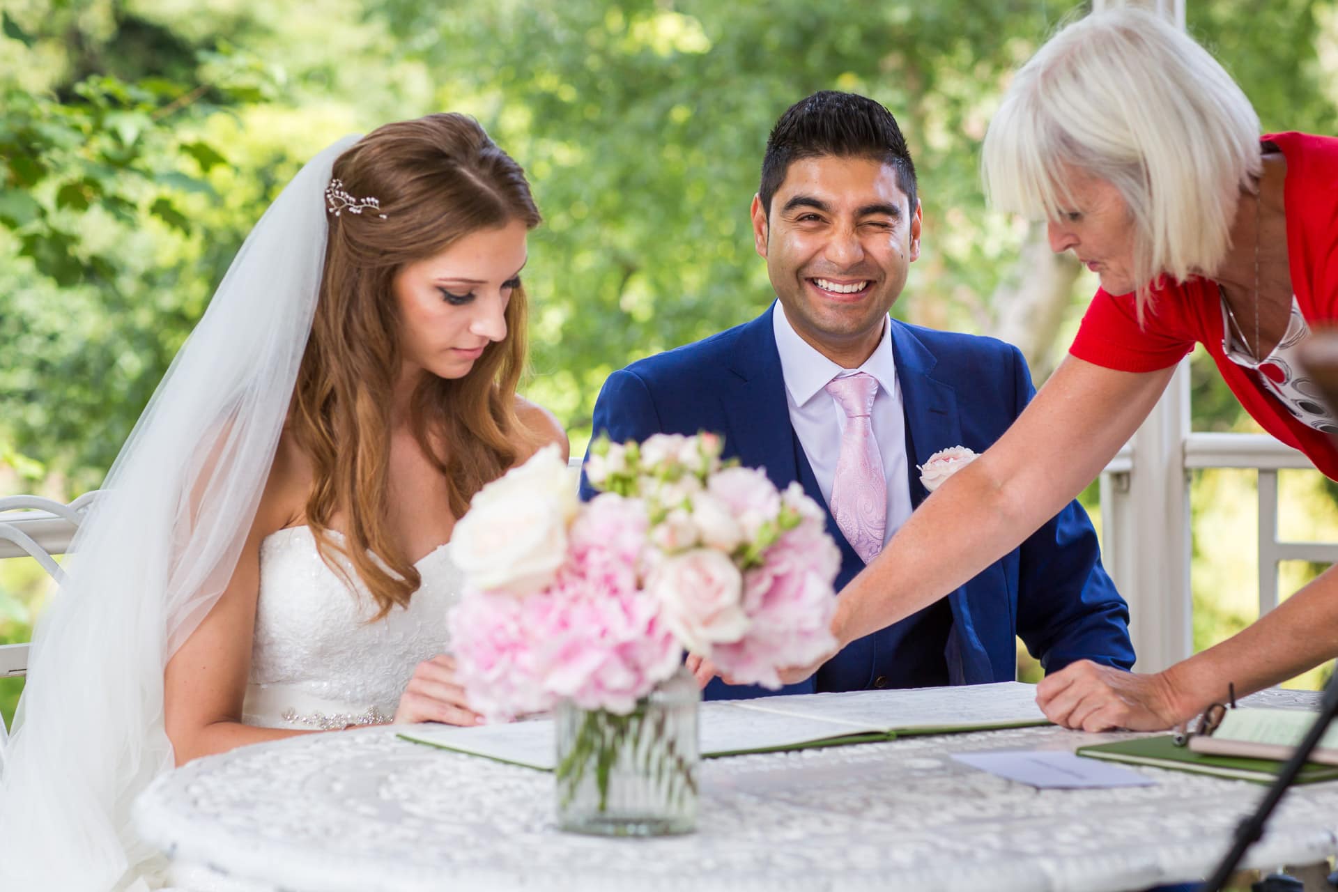 groom winking during signing the register