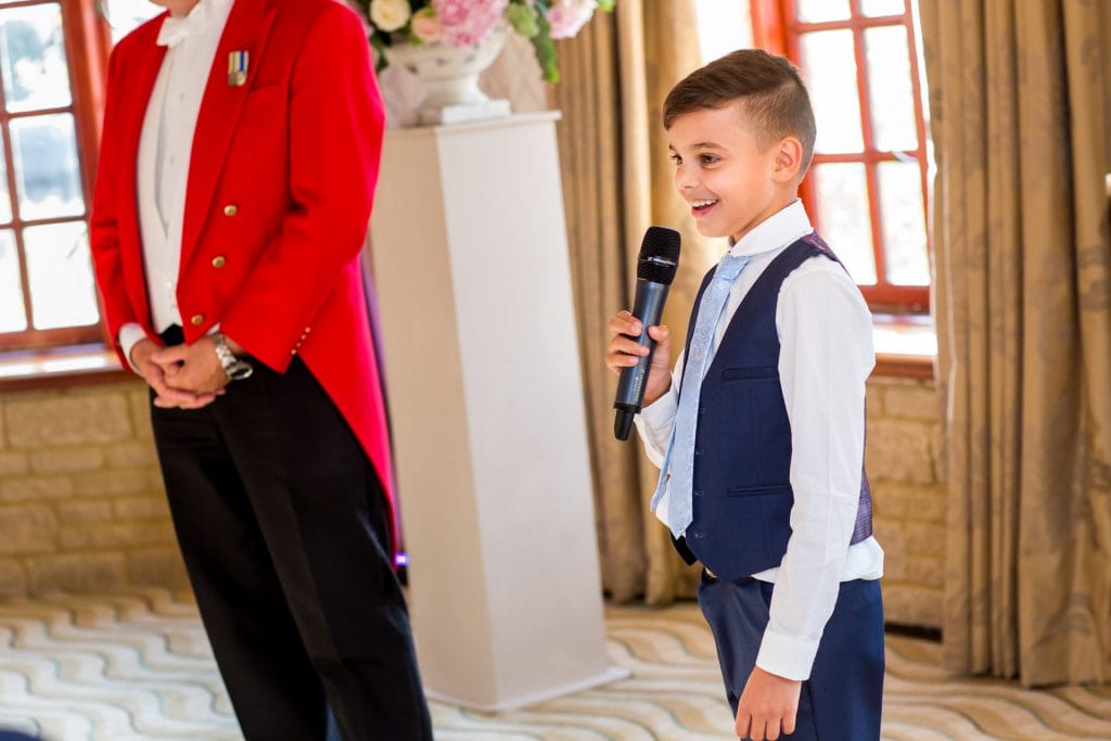 young boy giving a wedding speech