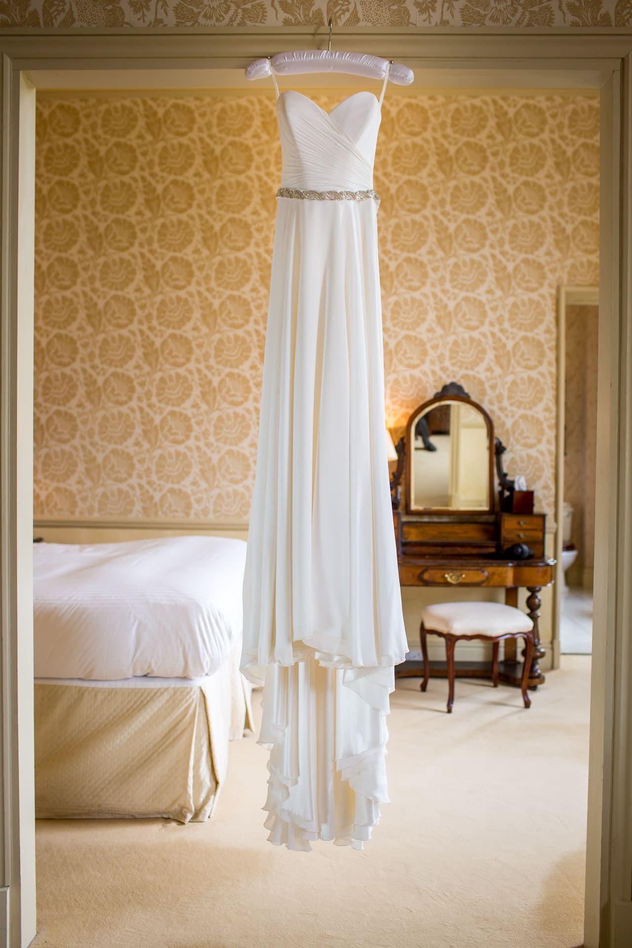 dress hanging at stapleford park bridal suite