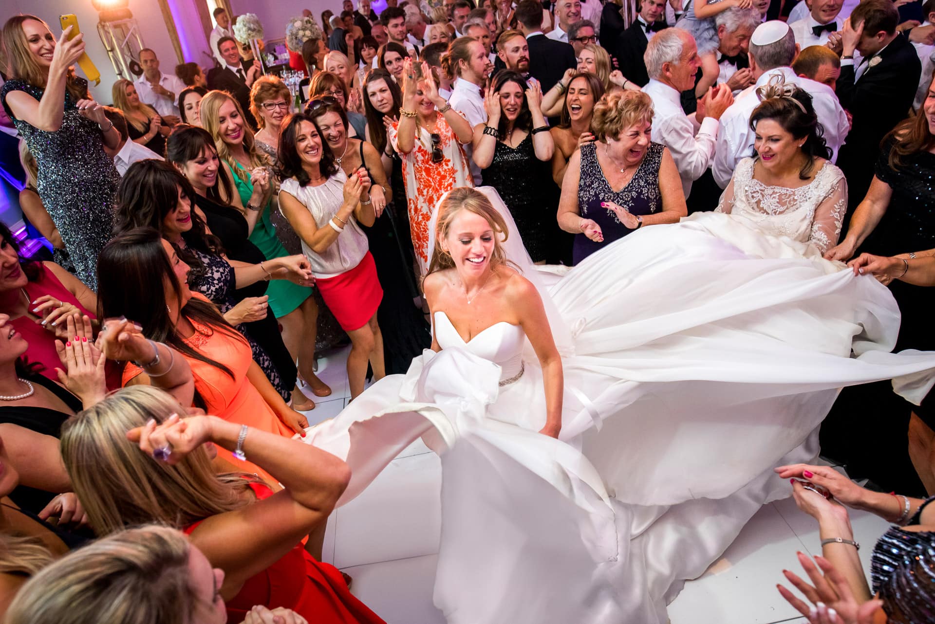 jewish bride dancing with dress spread out