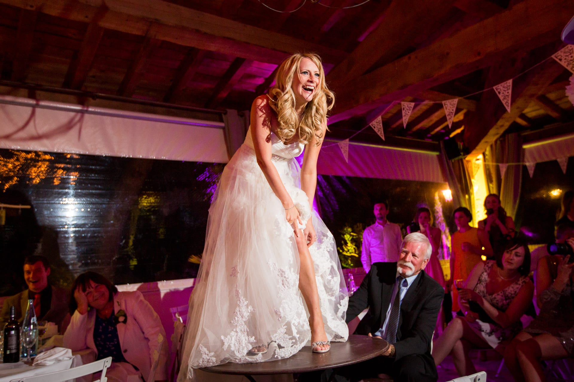 bride dancing on a table