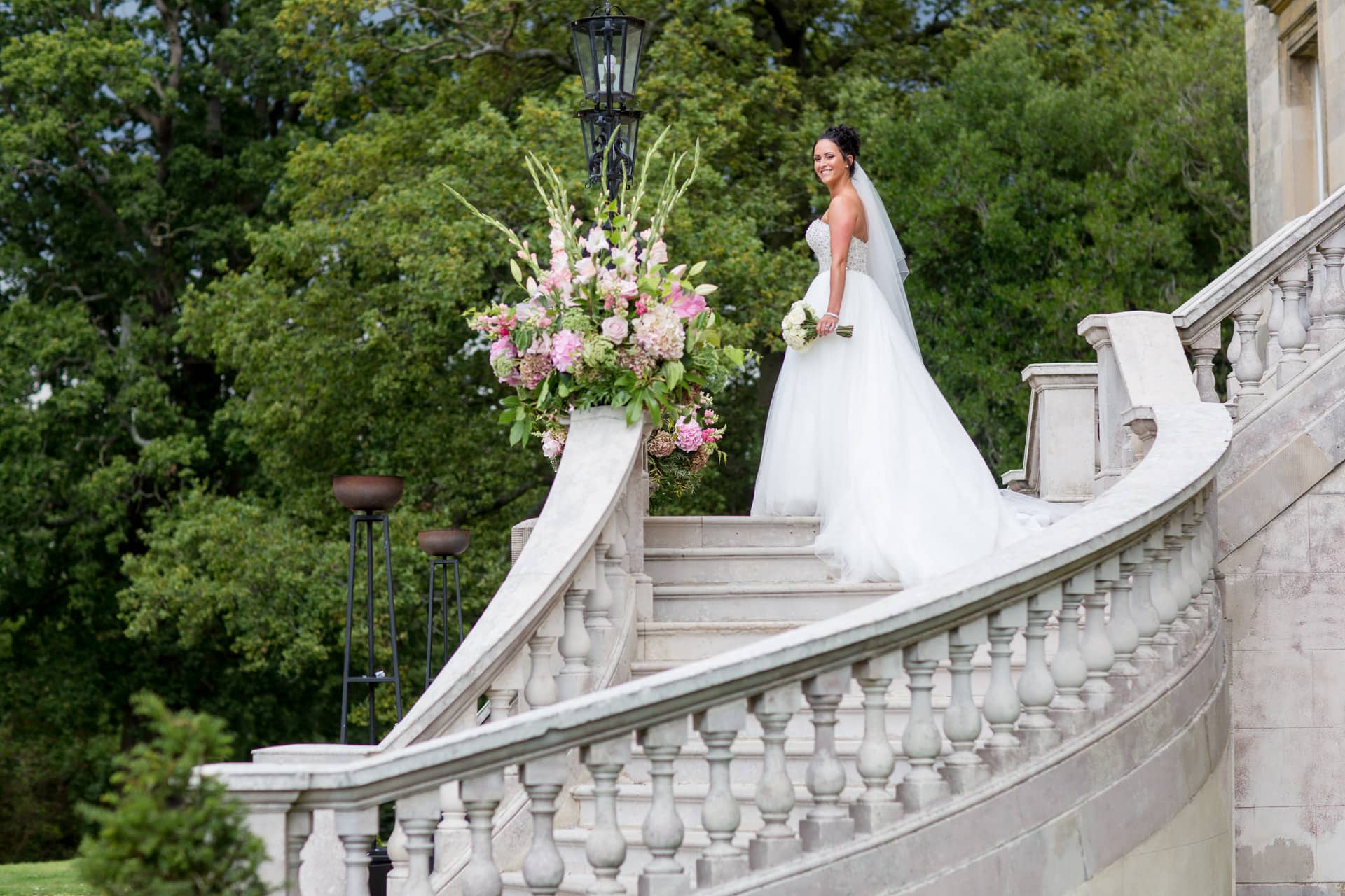 bride on stairs at Botleys Mansion