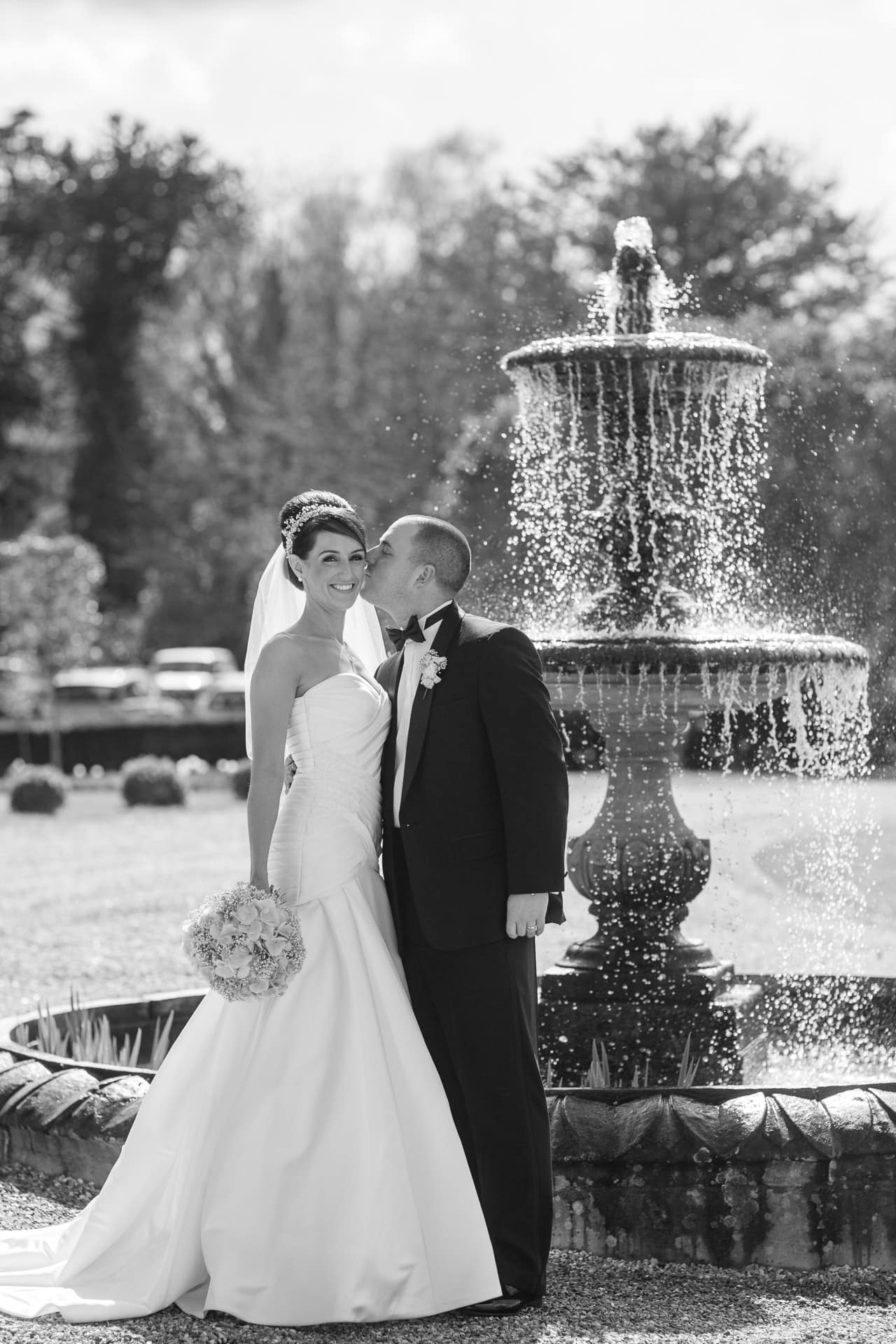 wedding couple by fountain at Botleys Mansion