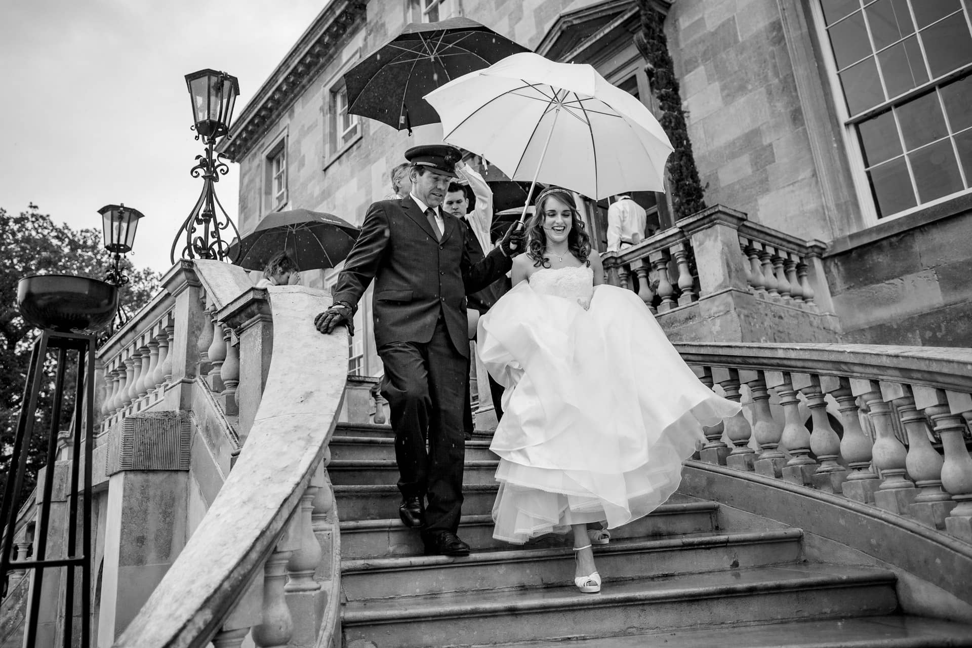 bride in the rain under umbrella