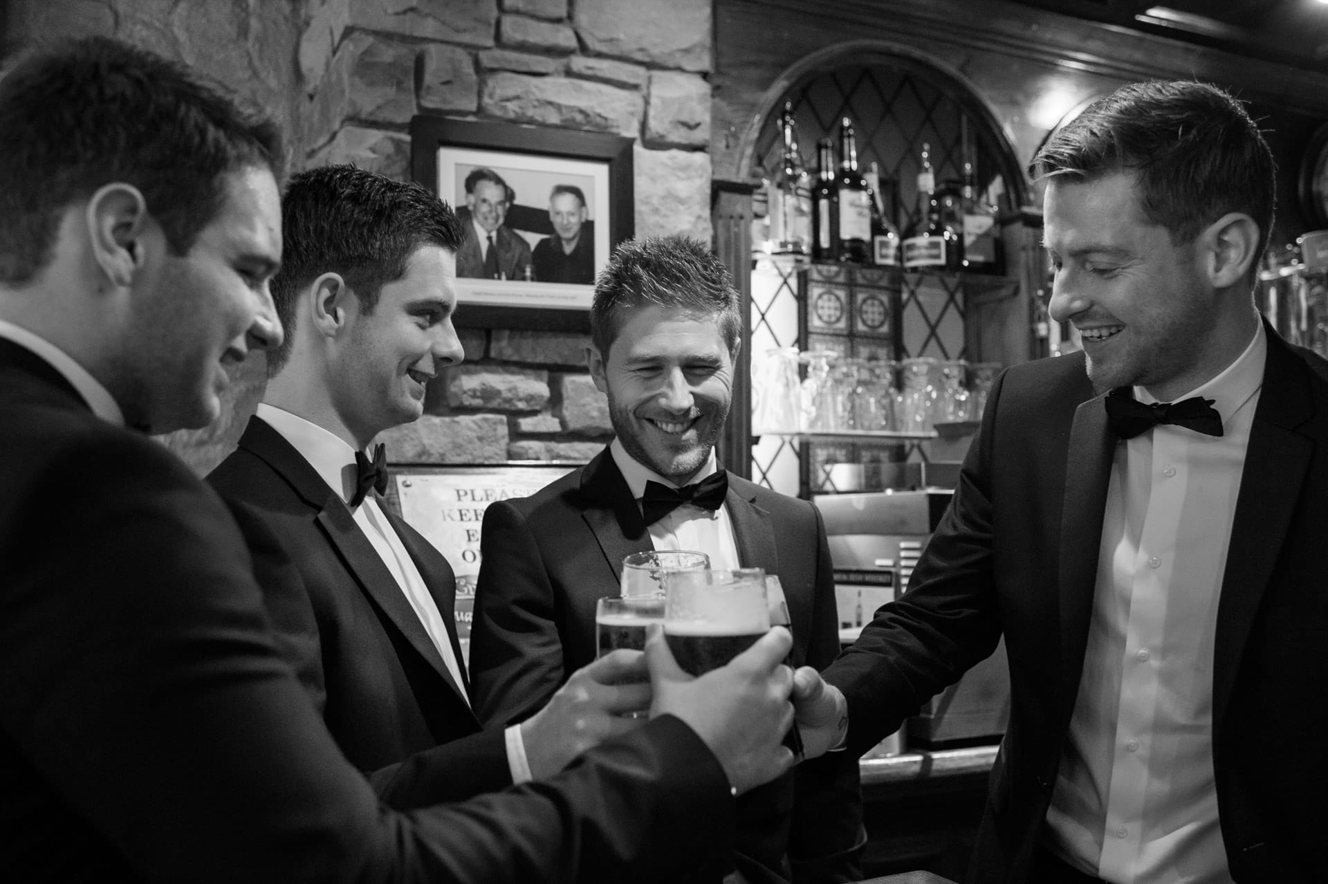 groomsmen drinking Guinness in Ireland