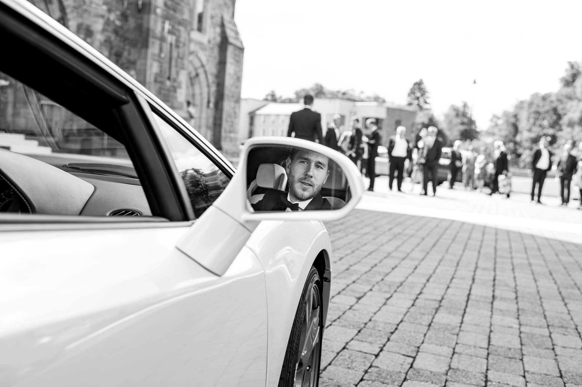 Groom arriving at church in a Lamborghini