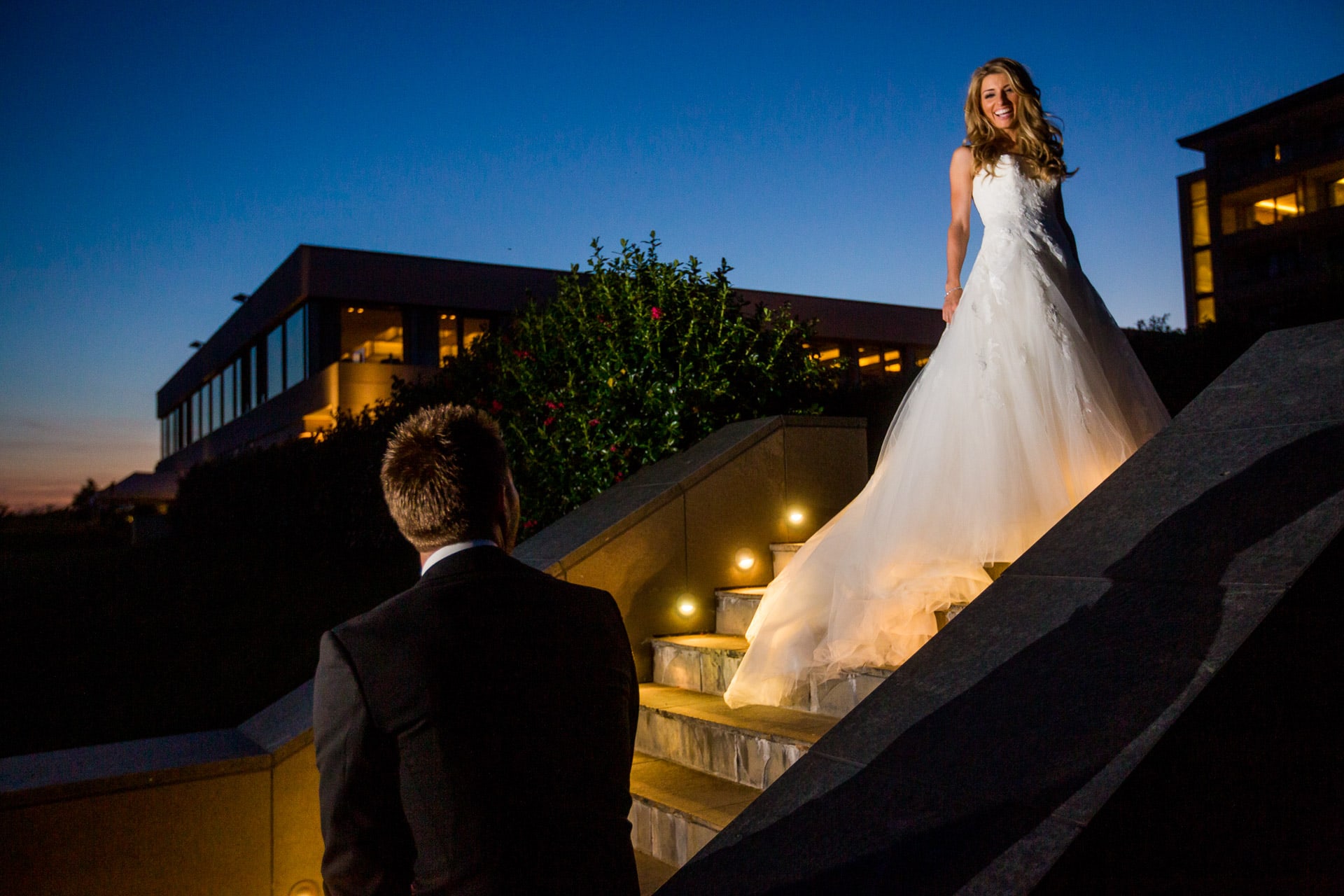 night time picture of bride on stairs