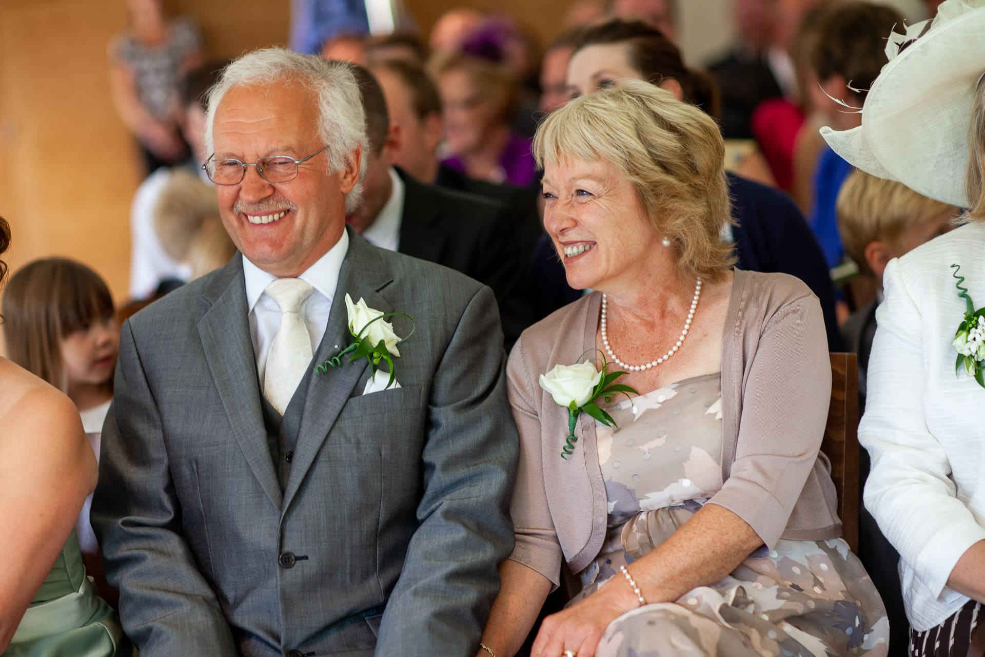 parents smiling during wedding ceremony
