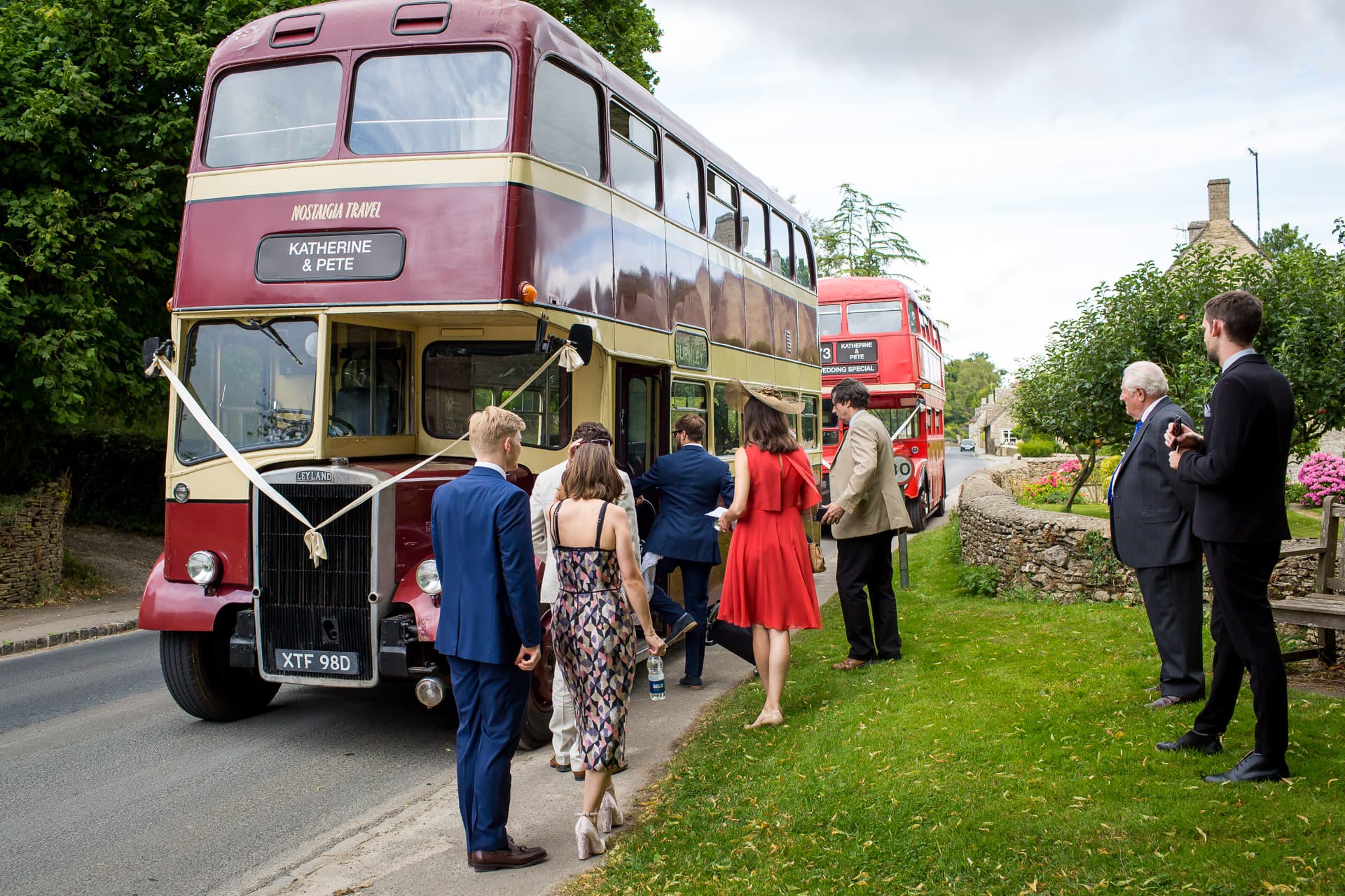 guests getting on wedding bus