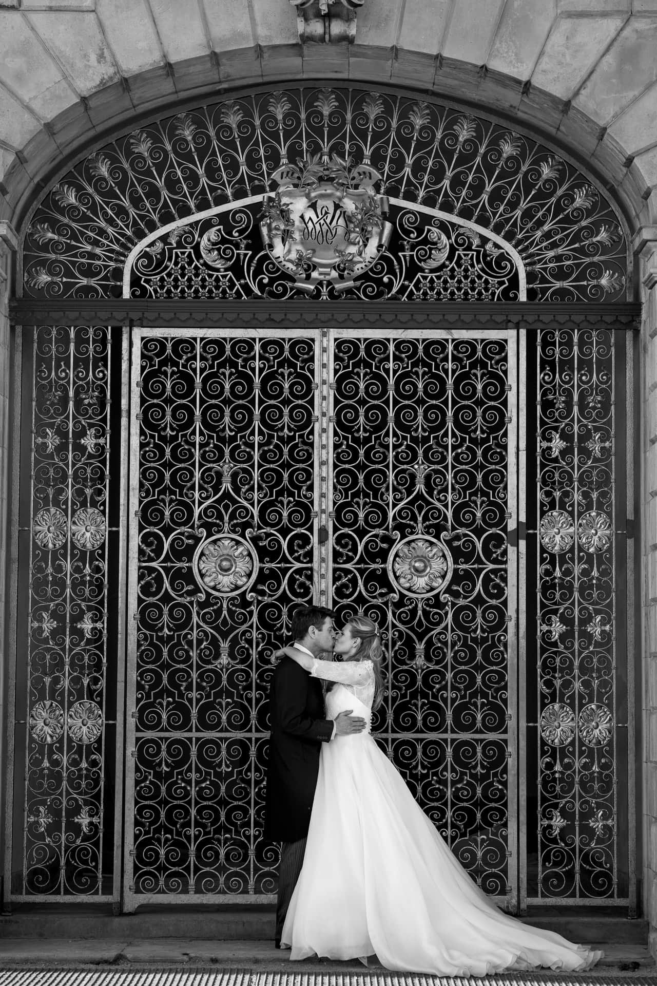 couple standing in ornate doorway
