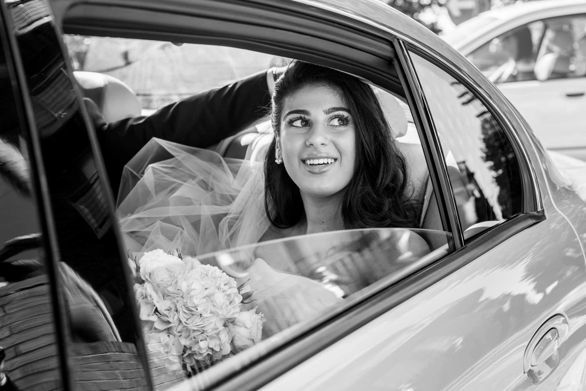 bride arriving at church in car