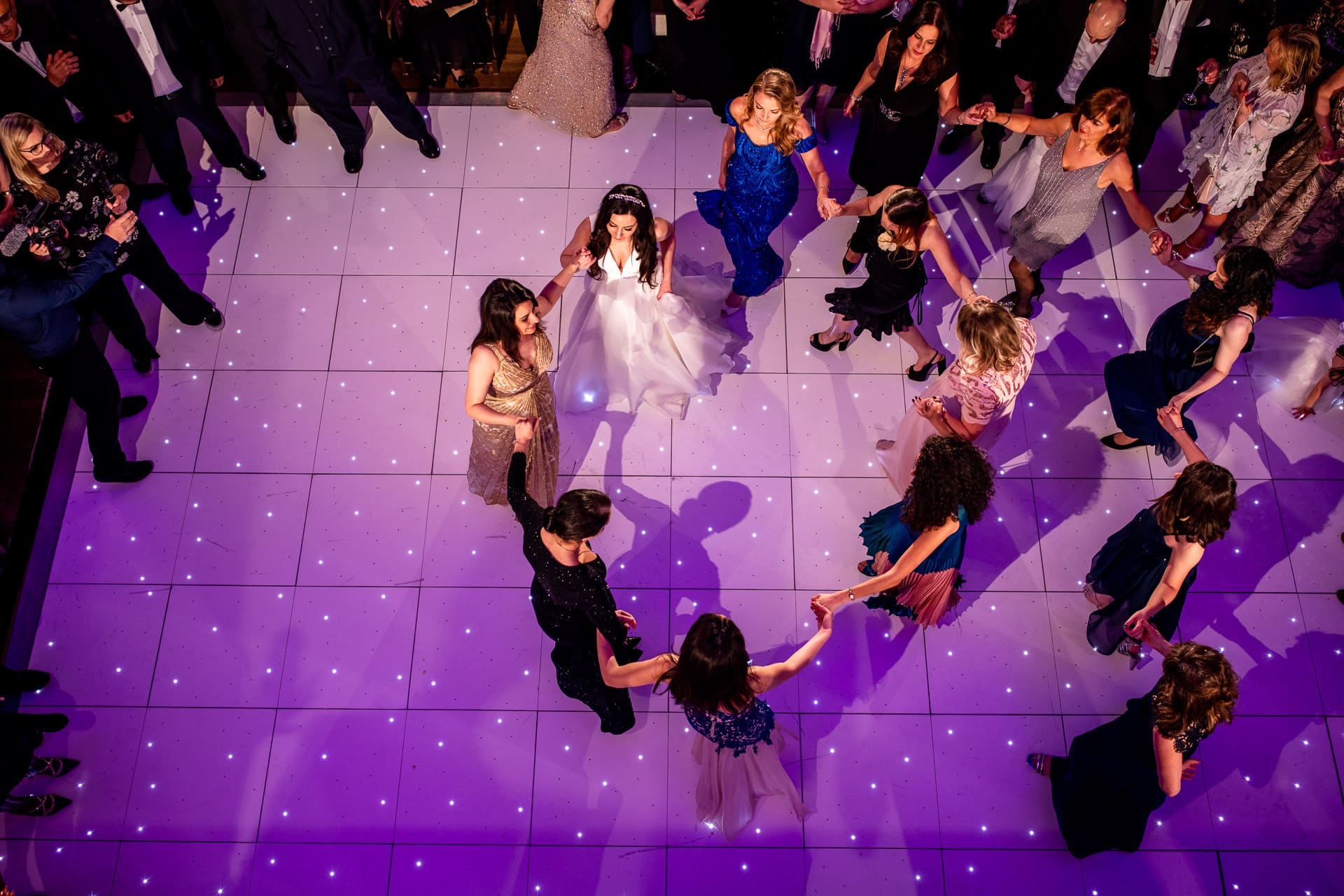 bride and her girlfriends in a circle