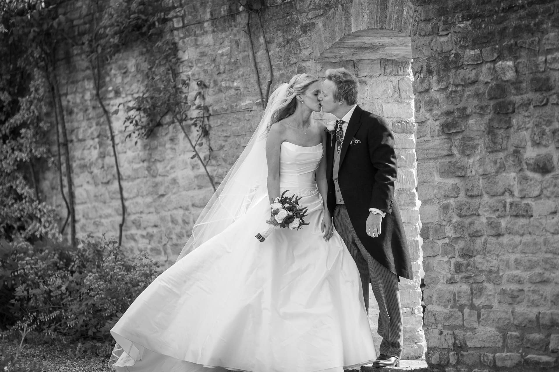 kissing by the stone wall