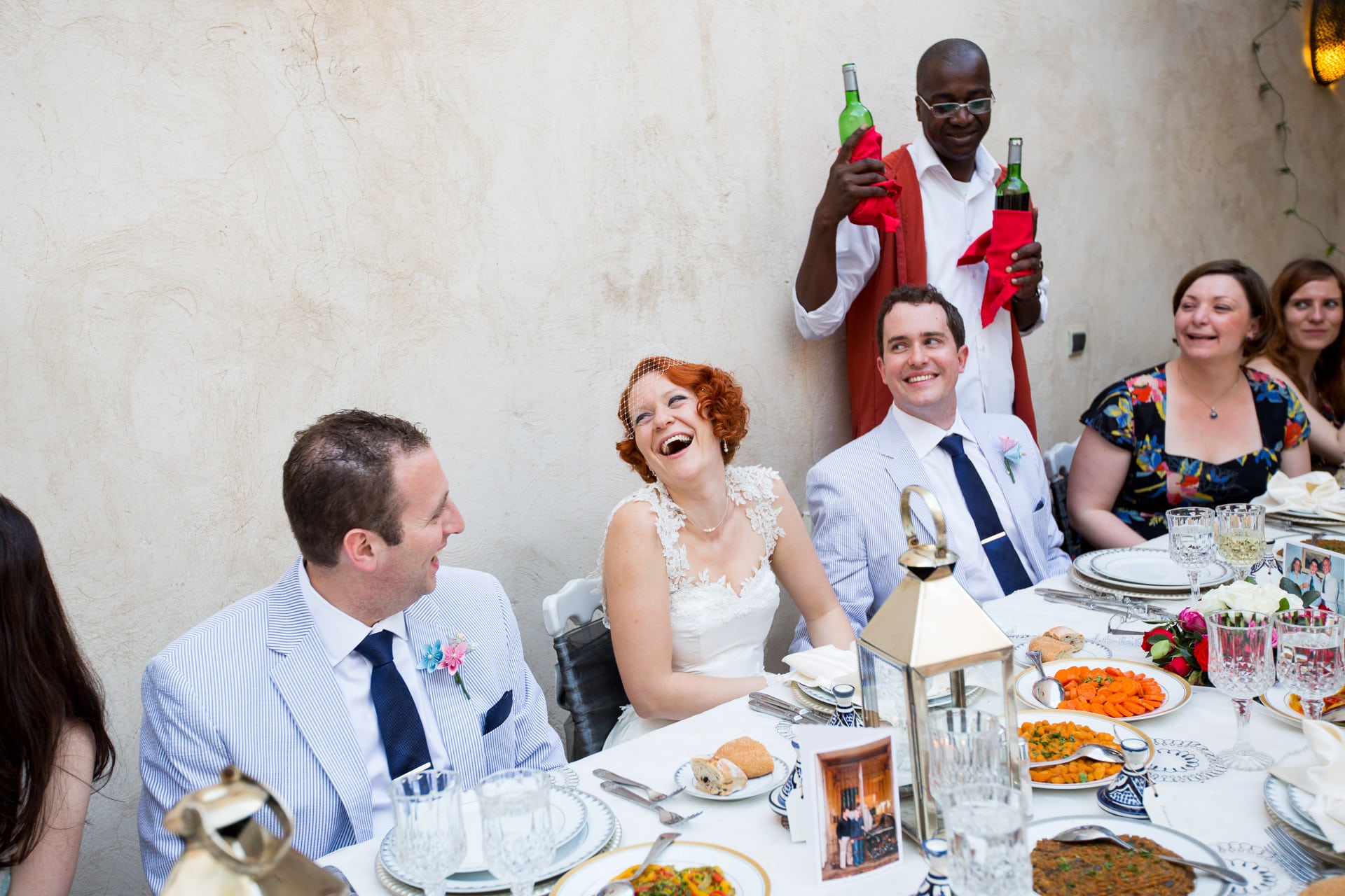 laughing bride during wedding dinner