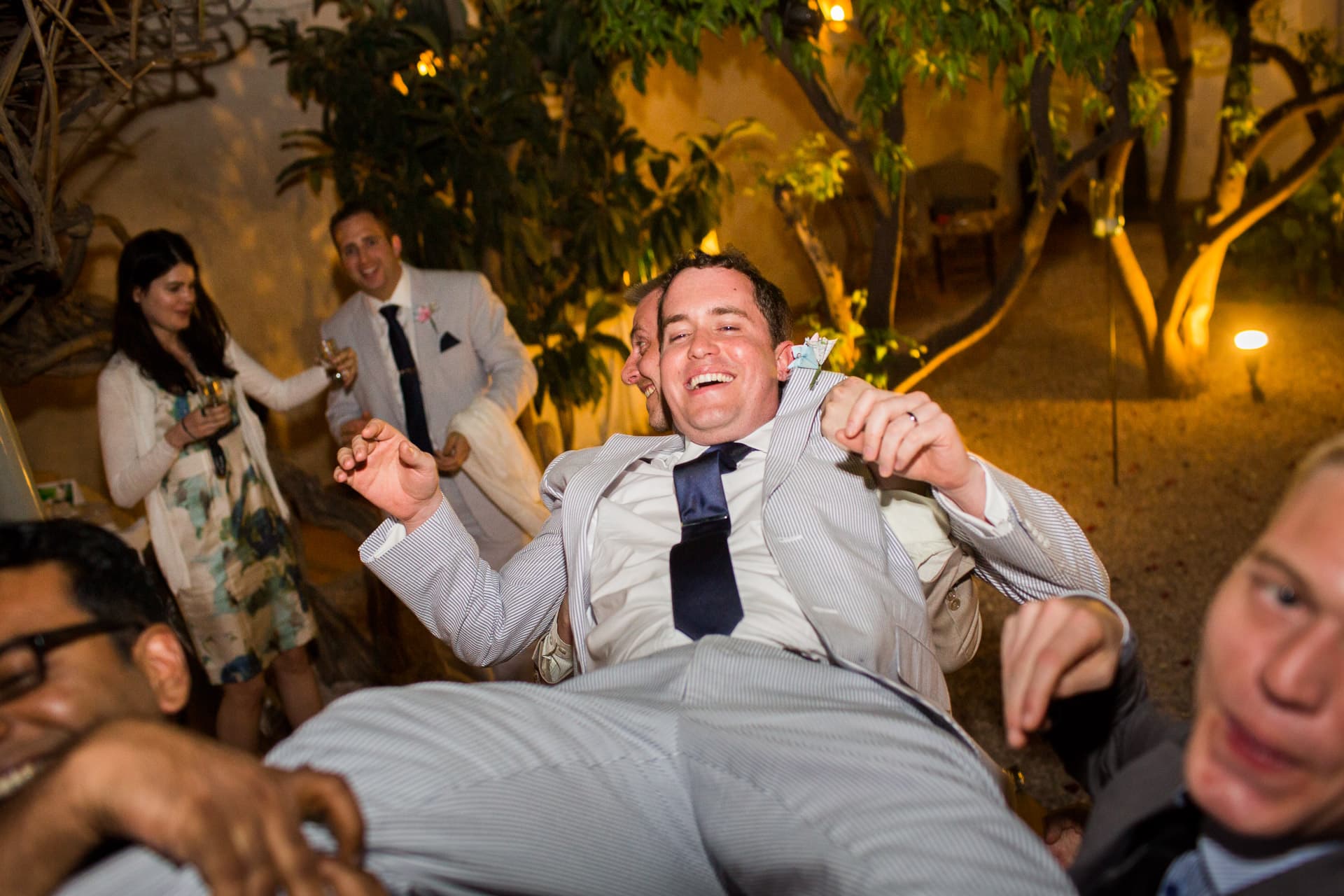 groom being lifted up