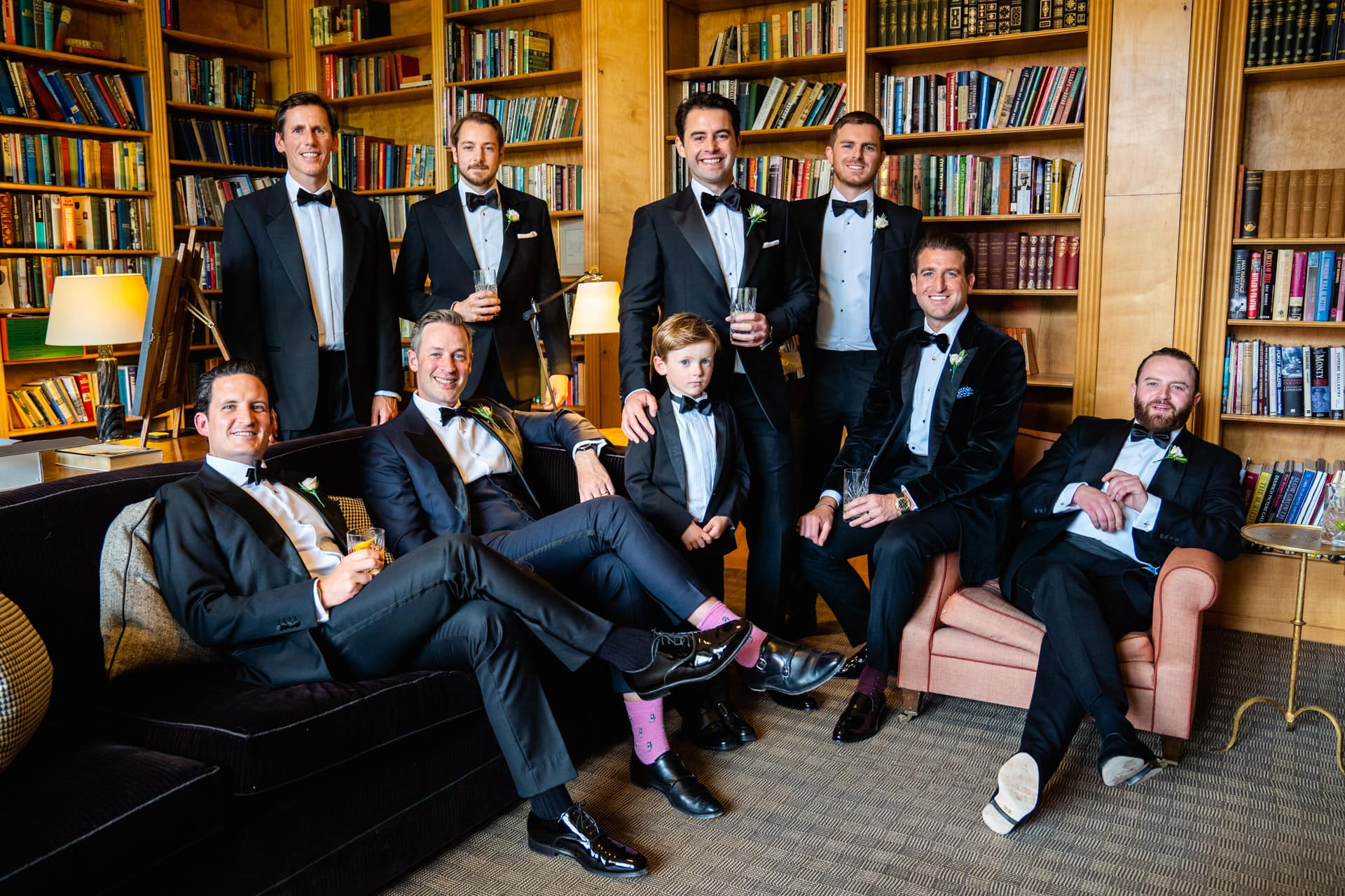 groomsmen in the library with scotch