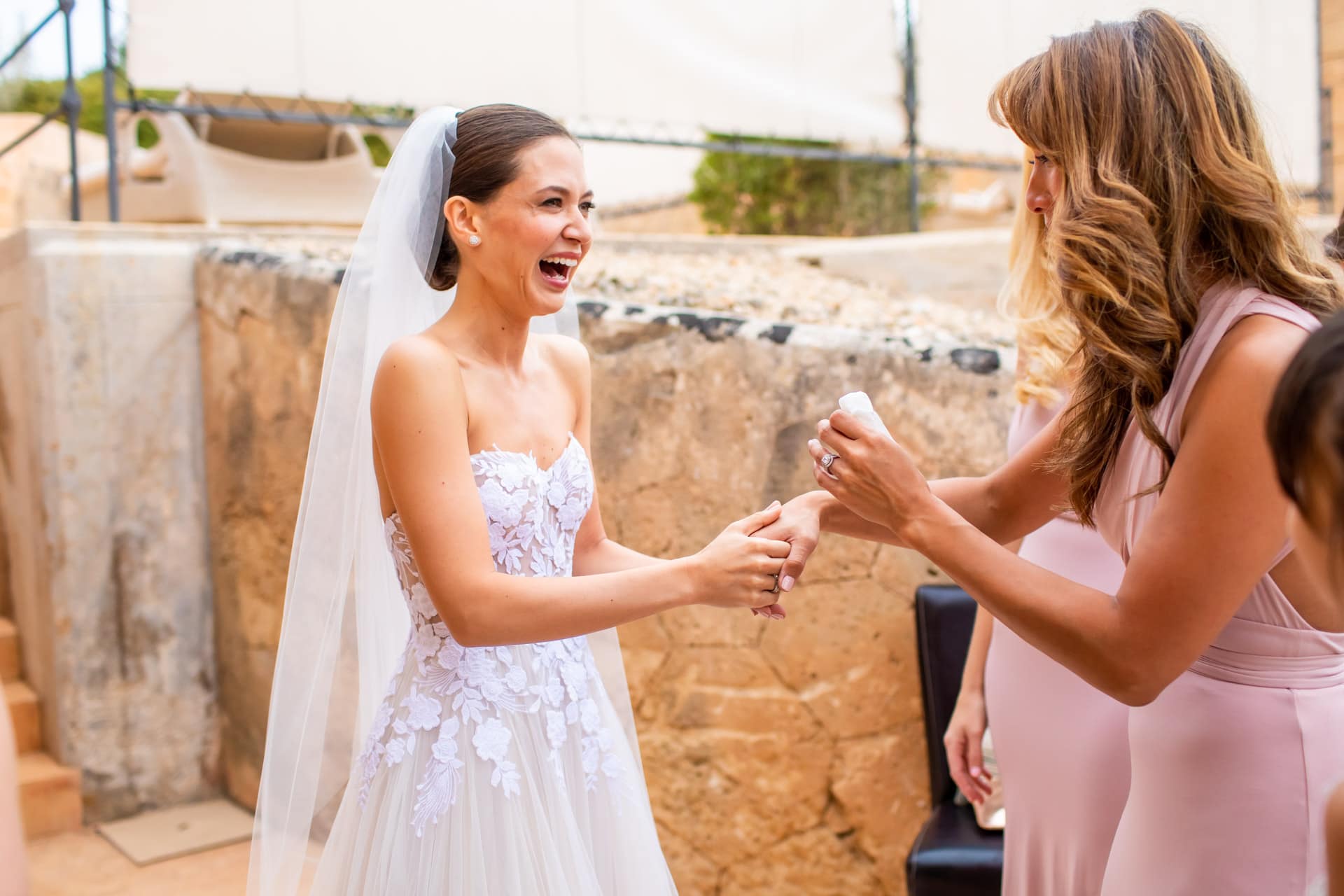 bride and her sister laughing