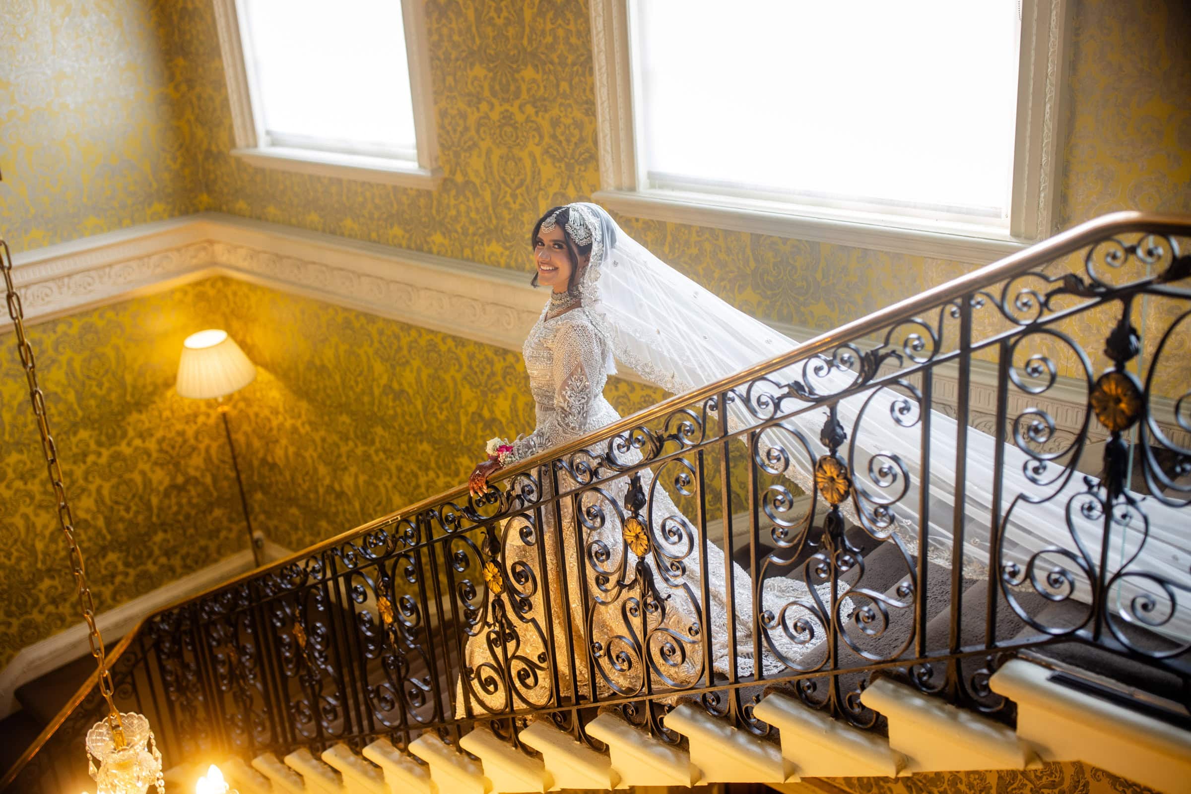 bride and amazing veil on the staircase