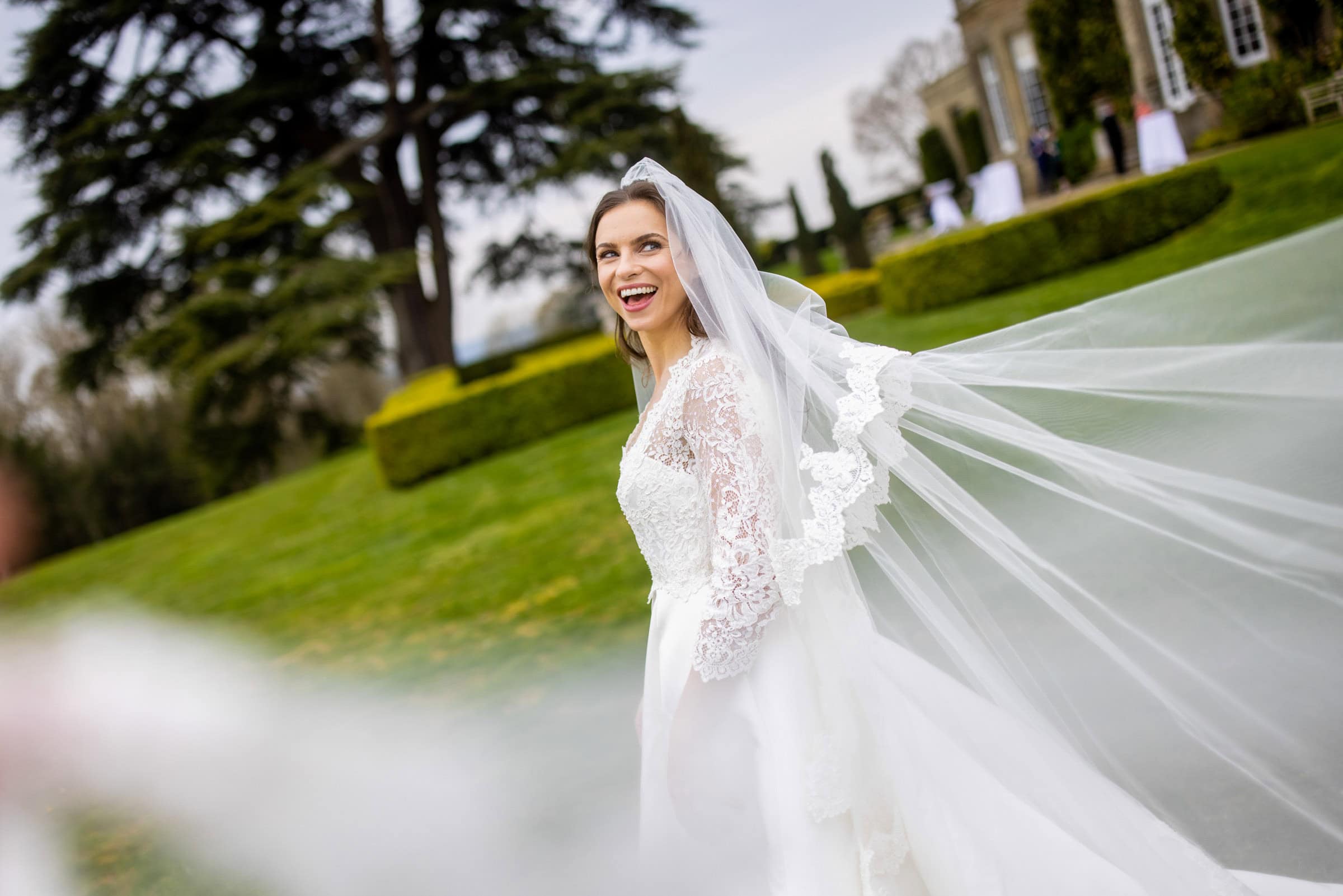 happy bride with a long veil