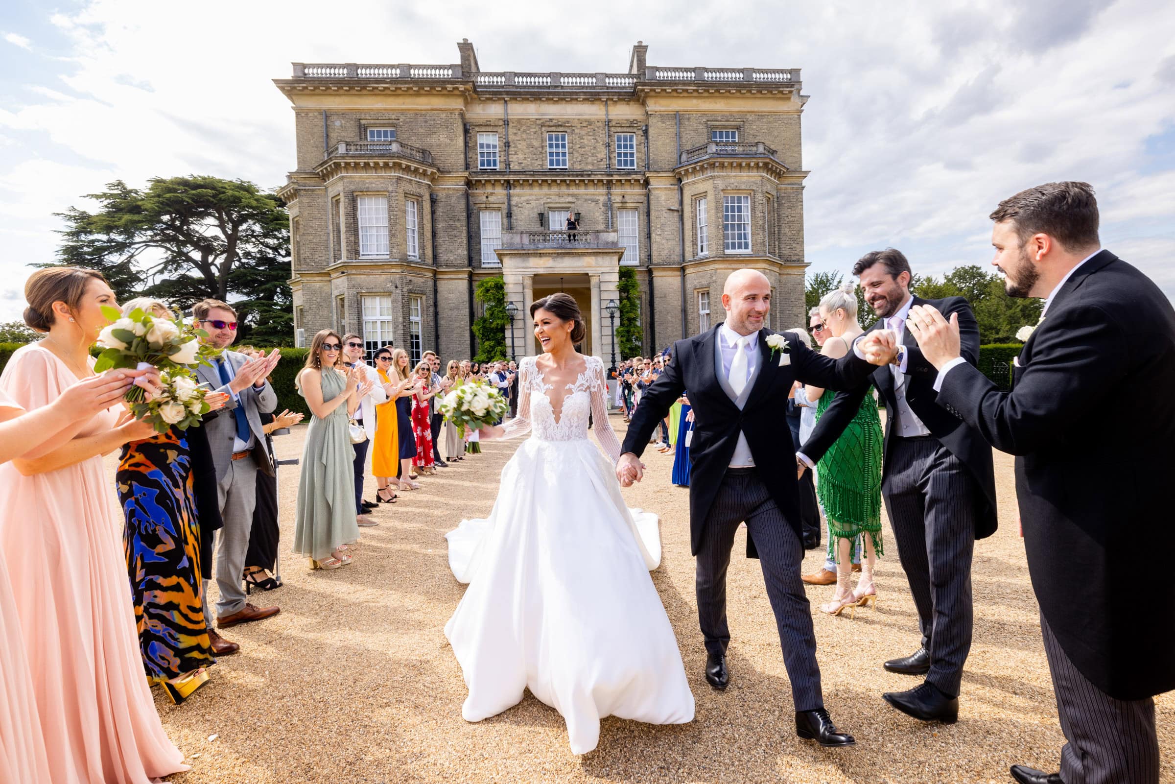 bride and groom exit to guests clapping