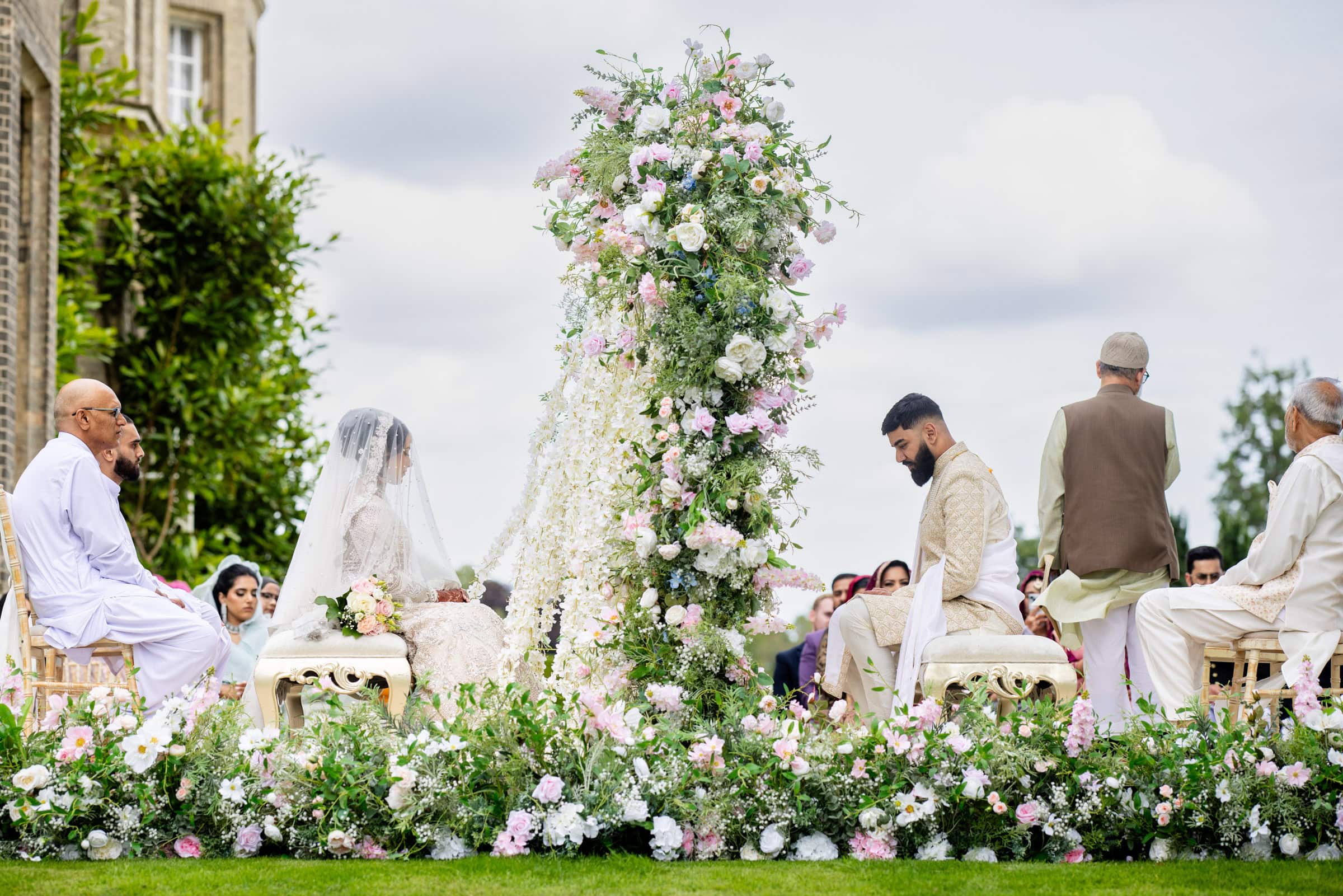 flower arch stage for outdoor ceremony