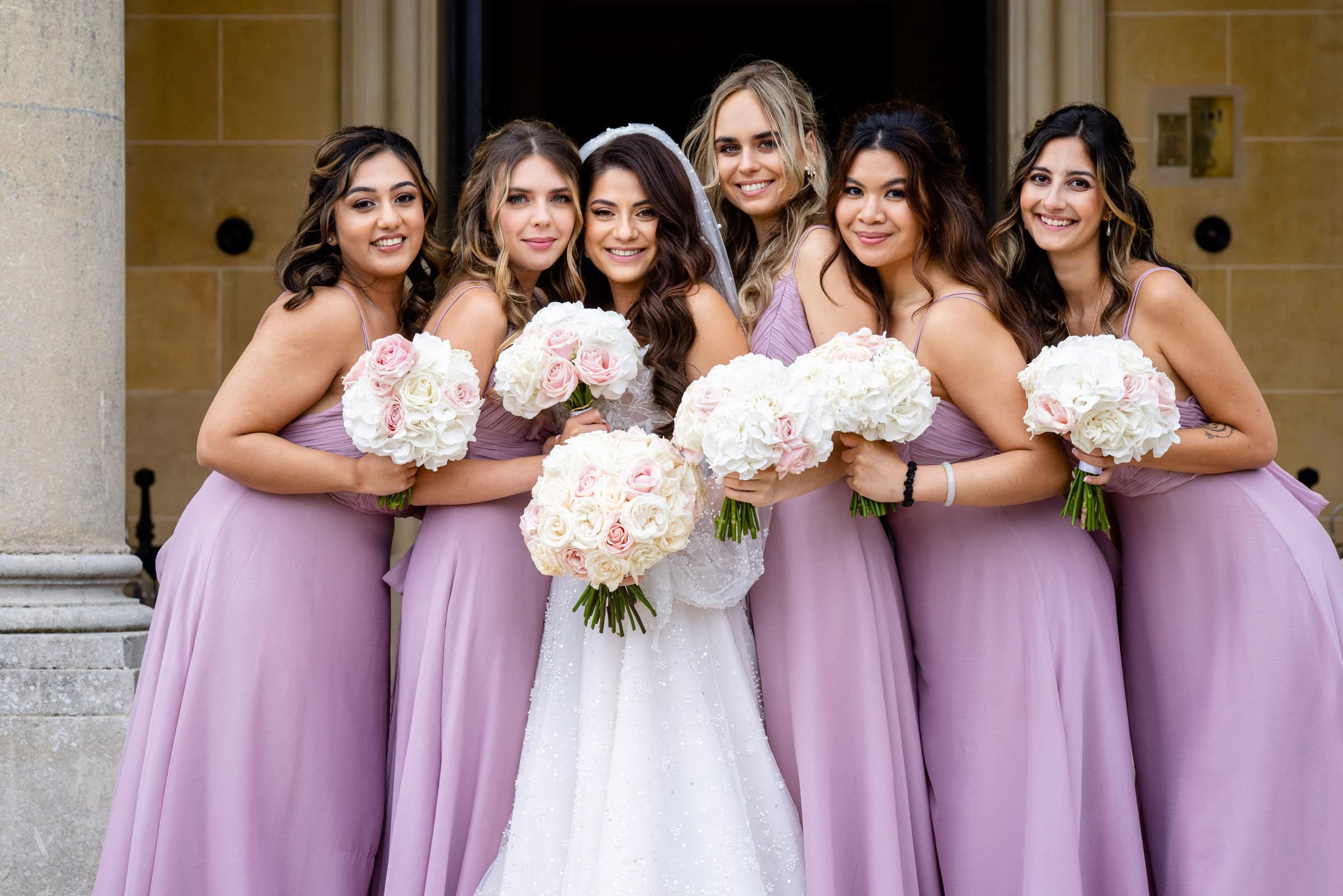 Bridesmaids huddle together